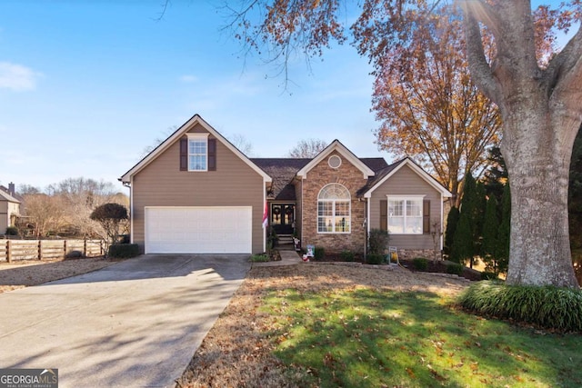 view of front property with a front lawn and a garage