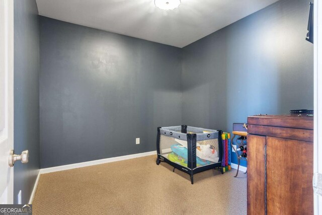 carpeted bedroom with ceiling fan, a raised ceiling, and a textured ceiling