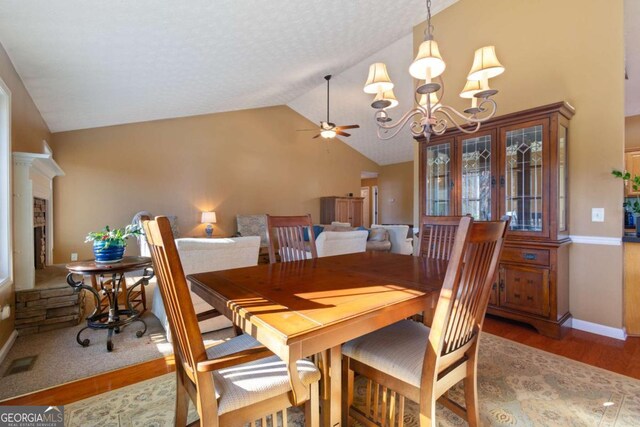 kitchen with a breakfast bar, sink, appliances with stainless steel finishes, kitchen peninsula, and light hardwood / wood-style floors