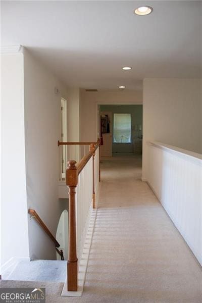 hallway with light carpet