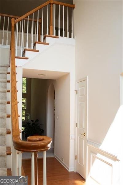 stairs with hardwood / wood-style flooring