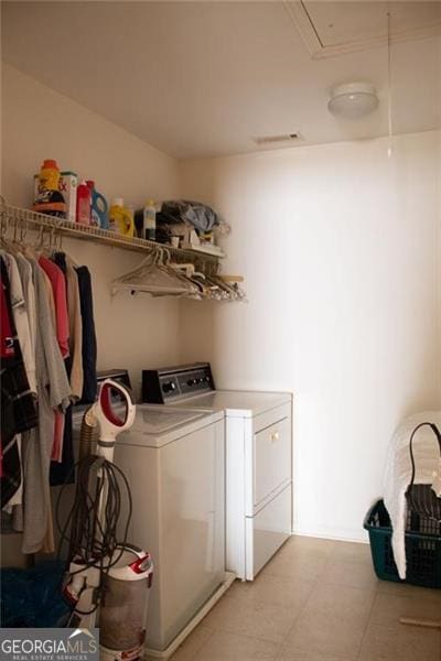 washroom with washing machine and clothes dryer