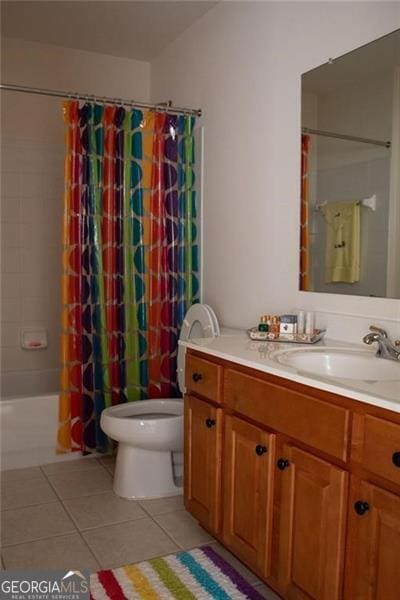 full bathroom featuring tile patterned floors, vanity, shower / tub combo, and toilet