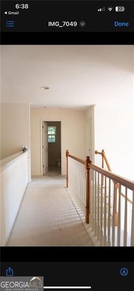 hallway featuring carpet floors