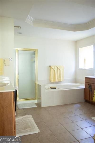 bathroom with plus walk in shower, vanity, tile patterned floors, and ornamental molding