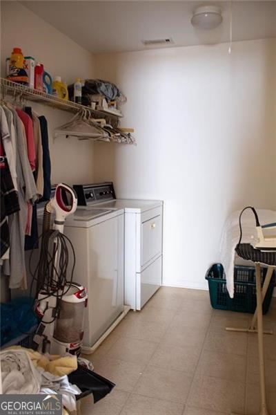 laundry room featuring washing machine and dryer