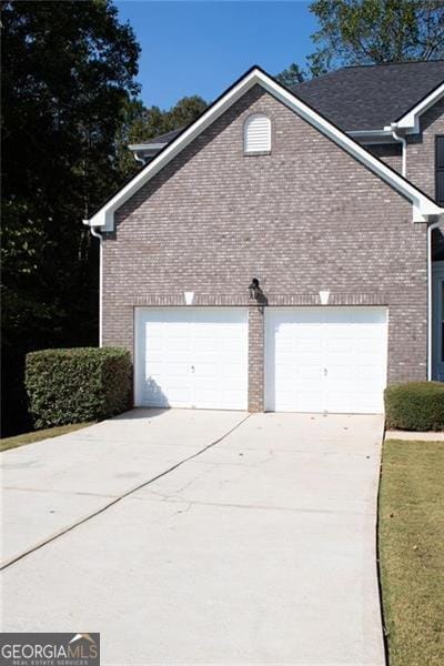 view of home's exterior with a garage