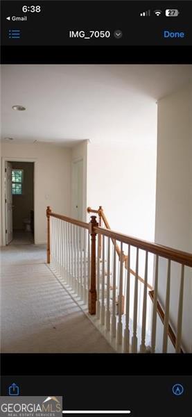 corridor featuring carpet floors