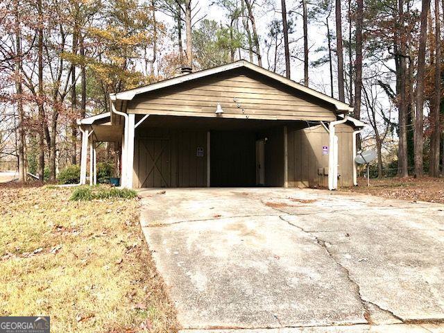 garage featuring a carport