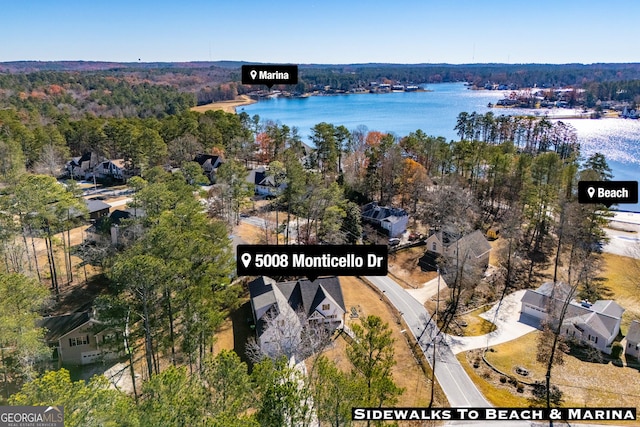 birds eye view of property featuring a water view