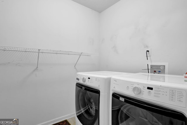 clothes washing area with independent washer and dryer