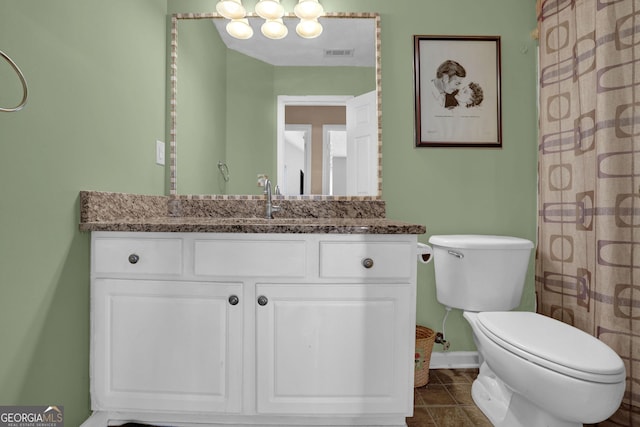 bathroom featuring tile patterned floors, vanity, toilet, and a shower with curtain