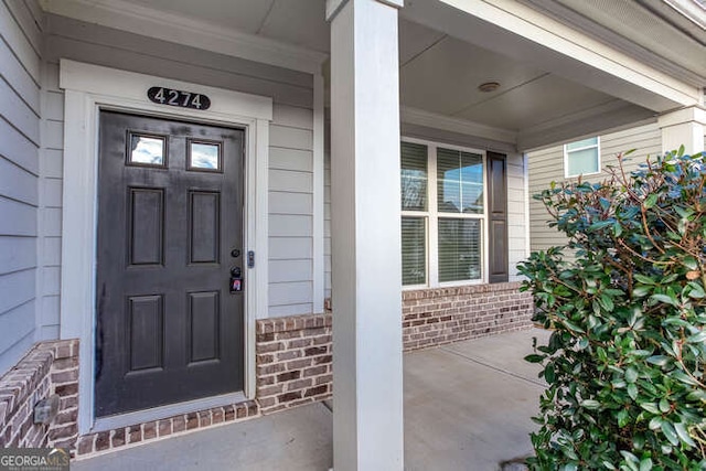 entrance to property with a porch