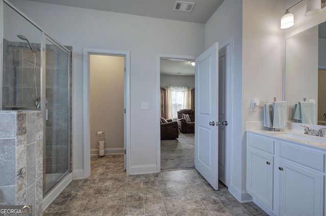 bathroom with vanity and an enclosed shower