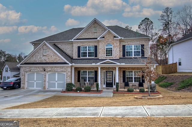 craftsman house with a garage and covered porch