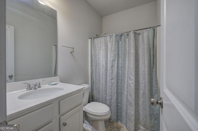 bathroom featuring walk in shower, tile patterned floors, vanity, and toilet