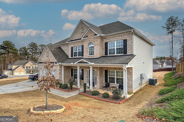 view of front of house with central AC unit and a porch