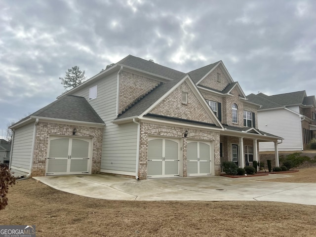 view of front of home with a garage and a front yard