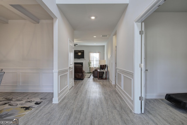 corridor with light hardwood / wood-style floors