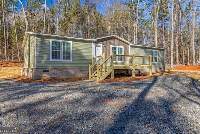 manufactured / mobile home with a wooden deck
