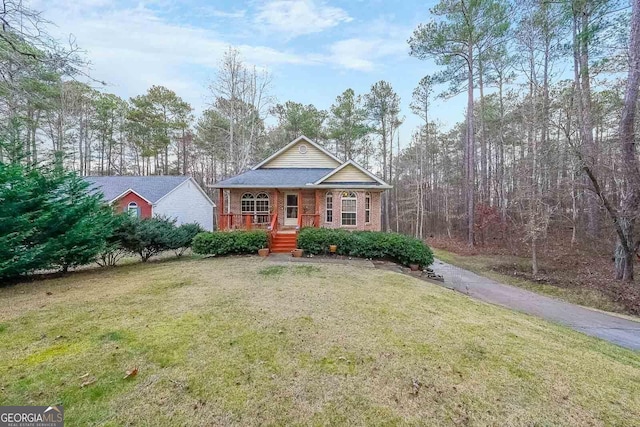 view of front of house with a front lawn and covered porch