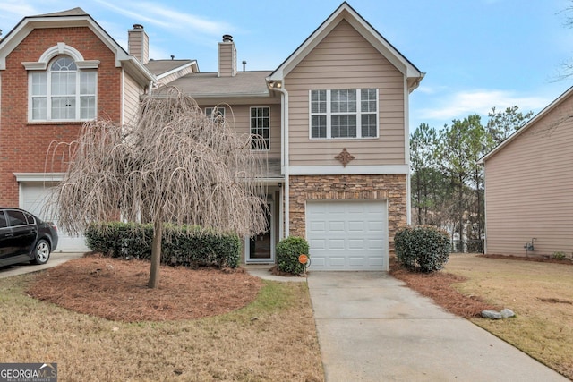 front facade with a front lawn and a garage