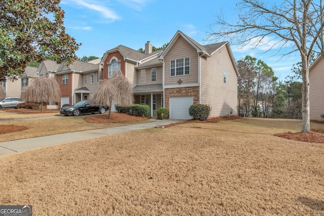 front facade featuring a garage and a front lawn