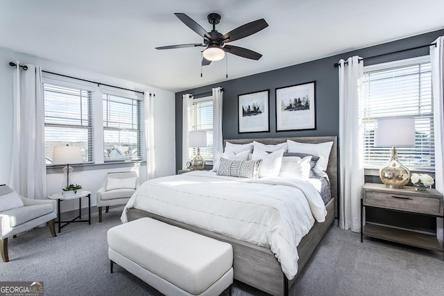 carpeted bedroom with ceiling fan