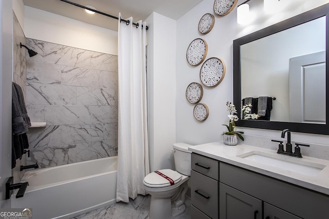 full bathroom with vanity, shower / tub combo, and toilet