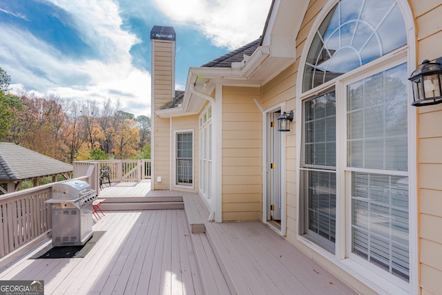 wooden deck with grilling area