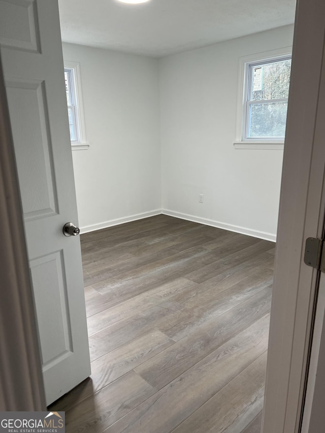 spare room with light wood-type flooring