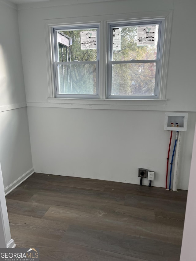 spare room featuring dark hardwood / wood-style flooring