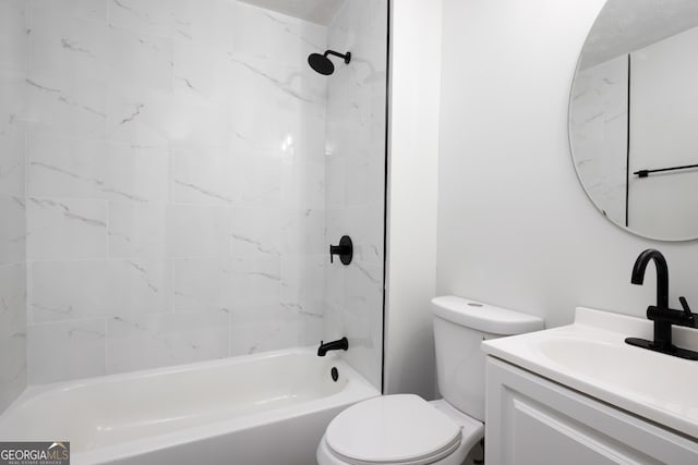 full bathroom featuring vanity, tiled shower / bath combo, and toilet