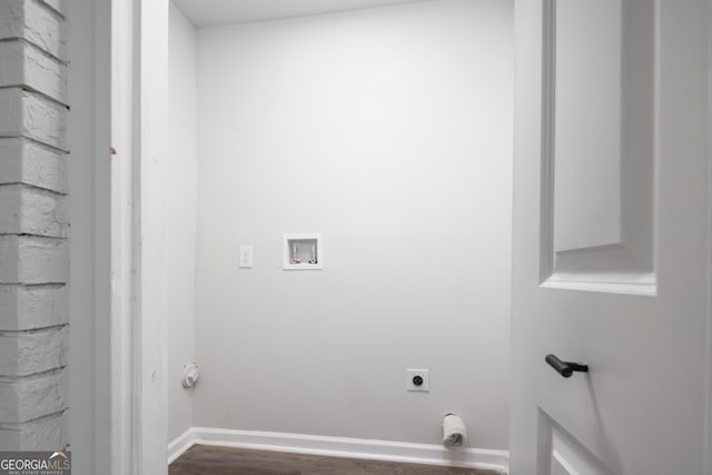 laundry room featuring hookup for an electric dryer, hookup for a washing machine, and dark hardwood / wood-style flooring