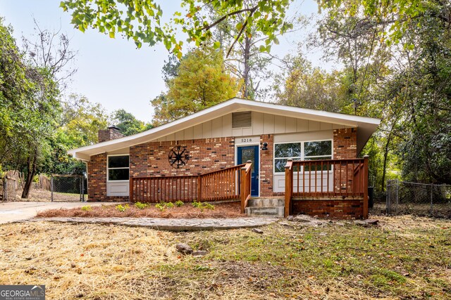 ranch-style house with a deck