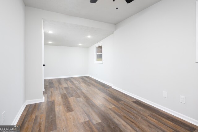 unfurnished room featuring ceiling fan and dark hardwood / wood-style floors