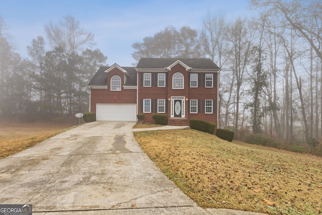 colonial home with a garage