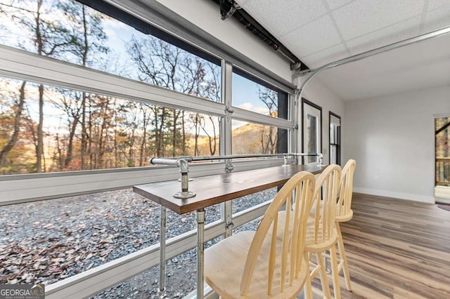 sunroom / solarium with a drop ceiling