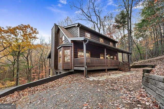 view of side of property featuring a porch