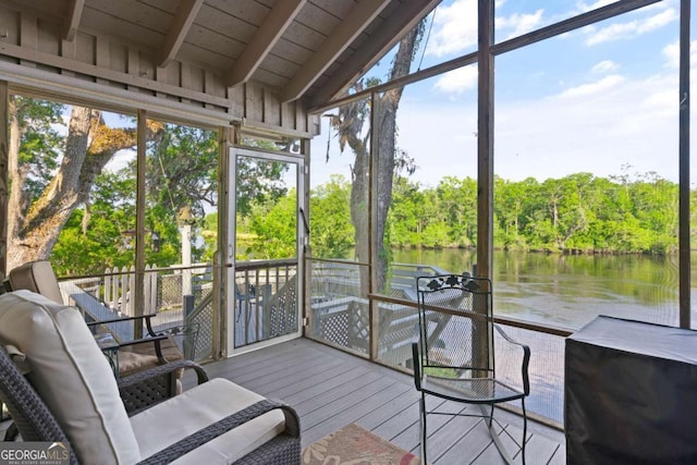 sunroom / solarium with vaulted ceiling with beams, a water view, and wood ceiling