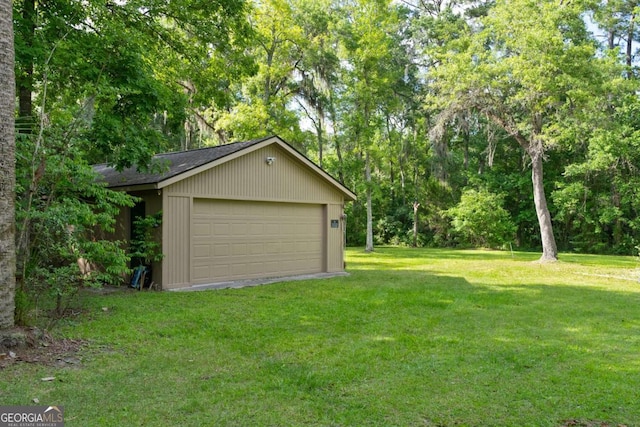 garage featuring a yard