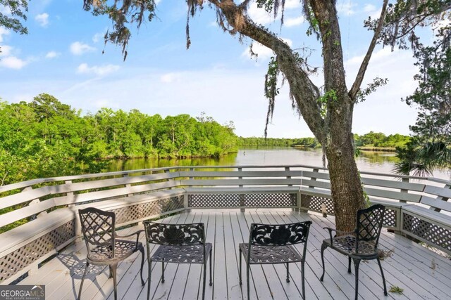 deck featuring a water view