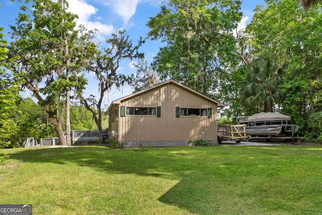 view of home's exterior featuring a yard