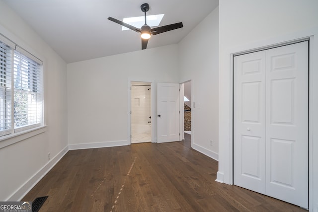 unfurnished bedroom featuring ceiling fan, dark wood-type flooring, and a closet