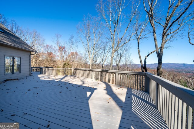 wooden terrace with a mountain view