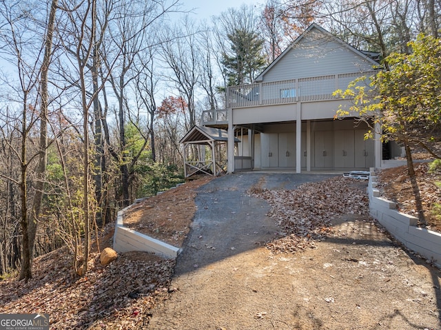 view of front of property featuring a wooden deck