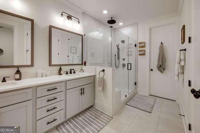 bathroom with vanity and a shower with shower door