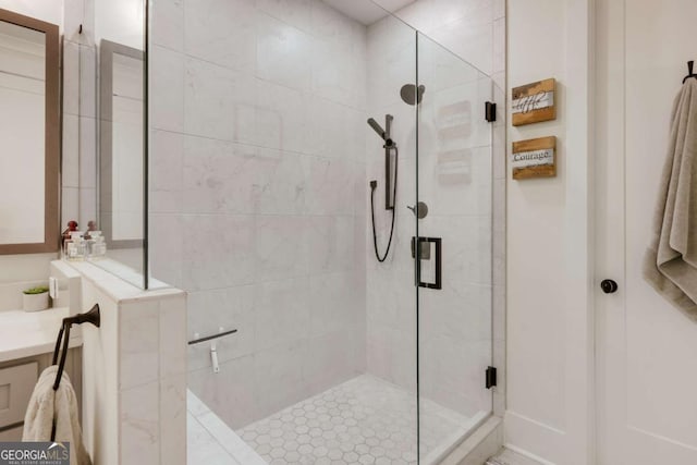 bathroom featuring a shower with door