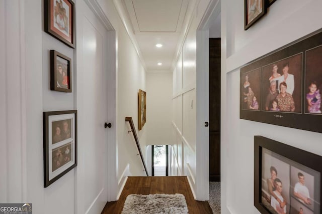 hall featuring dark hardwood / wood-style floors and crown molding