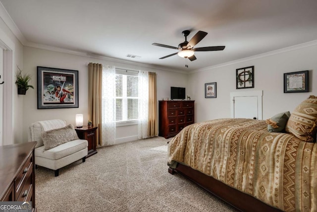 carpeted bedroom with ceiling fan and crown molding